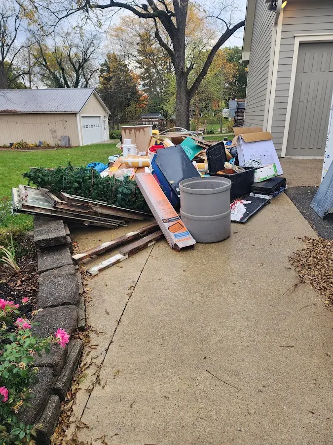 Dumpster being loaded with debris for Residential Dumpster Rental in Millsboro